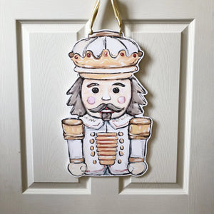 White Gold Nutcracker Door Hanger