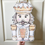 White Gold Nutcracker Door Hanger